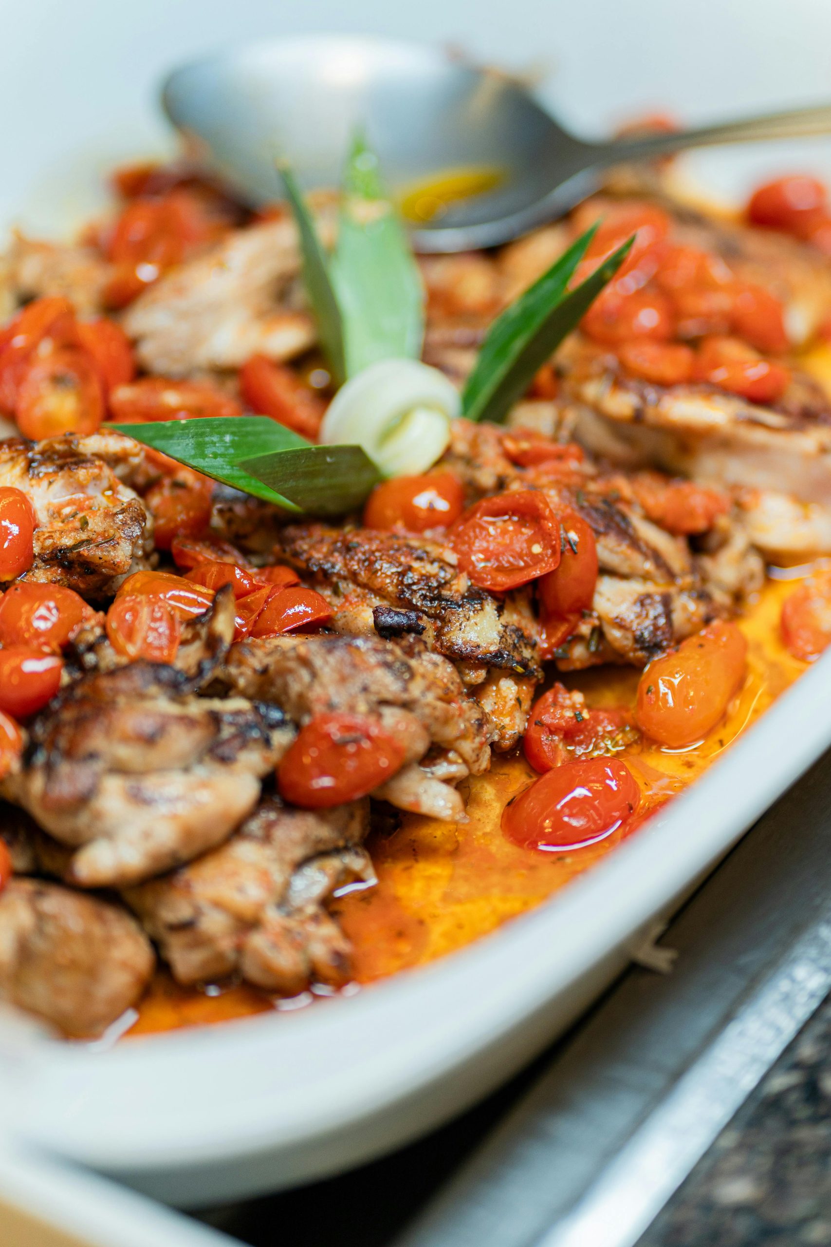 Savor the flavors of roasted chicken with juicy cherry tomatoes in a rich sauce.